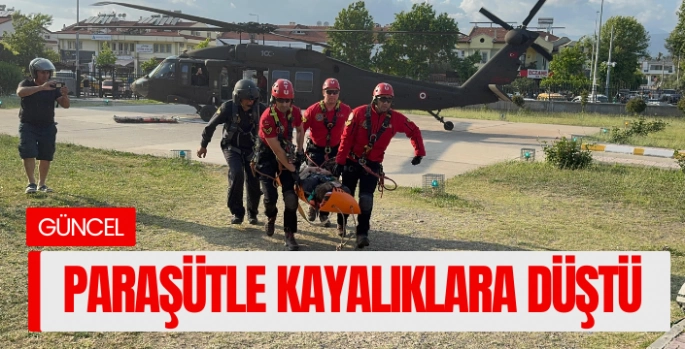 Turist paraşütle kayalıklara düştü